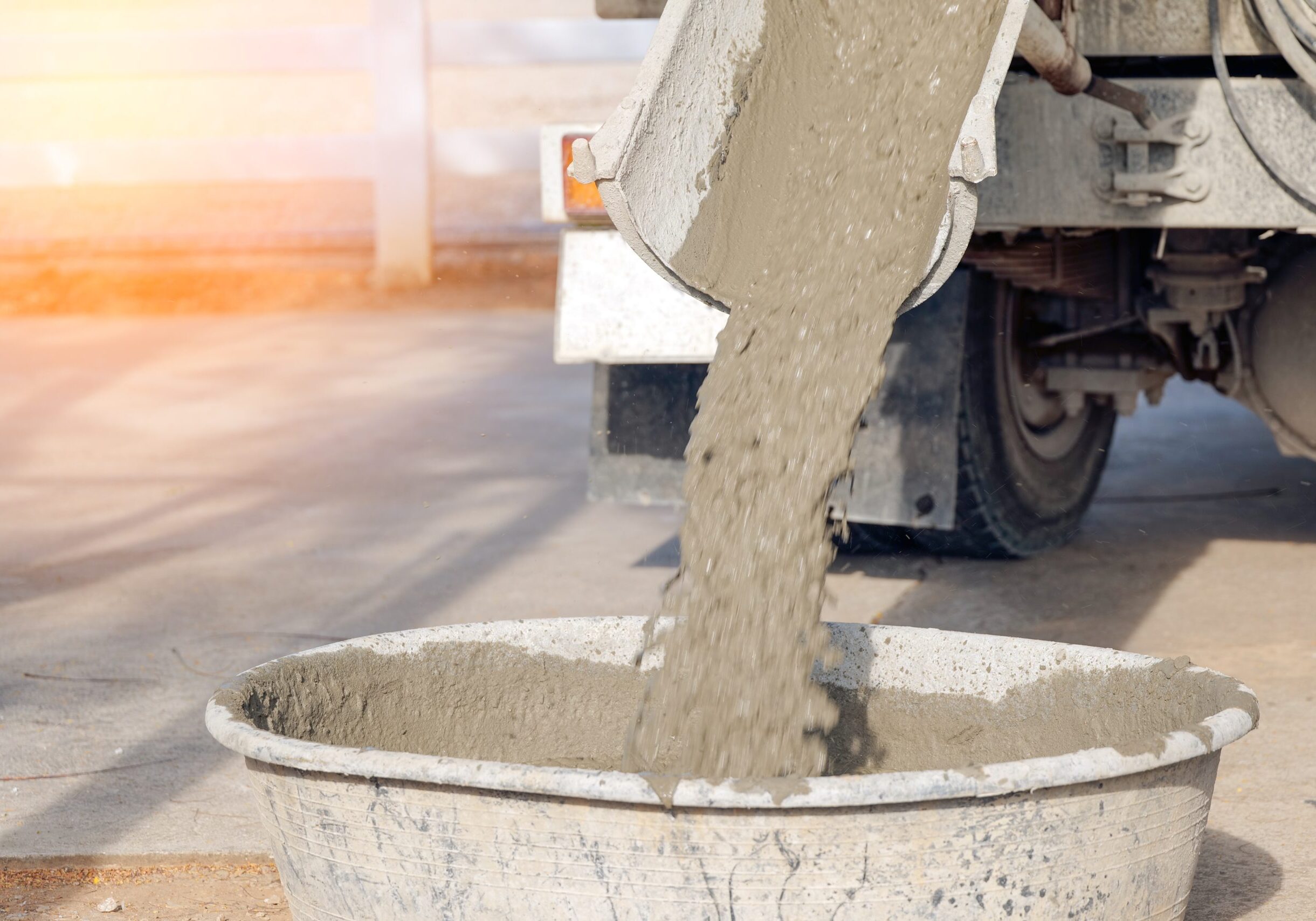 Pouring,Ready-mixed,Concrete,In,The,Basin,For,Construction